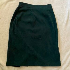 Long dark green skirt. Barley worn and collects lint/ hair easily.